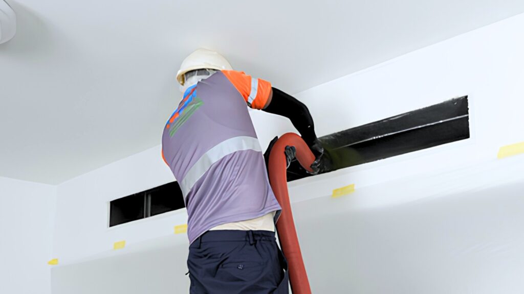 Mega Meter technician using HEPA negative air machine on a residential AC duct