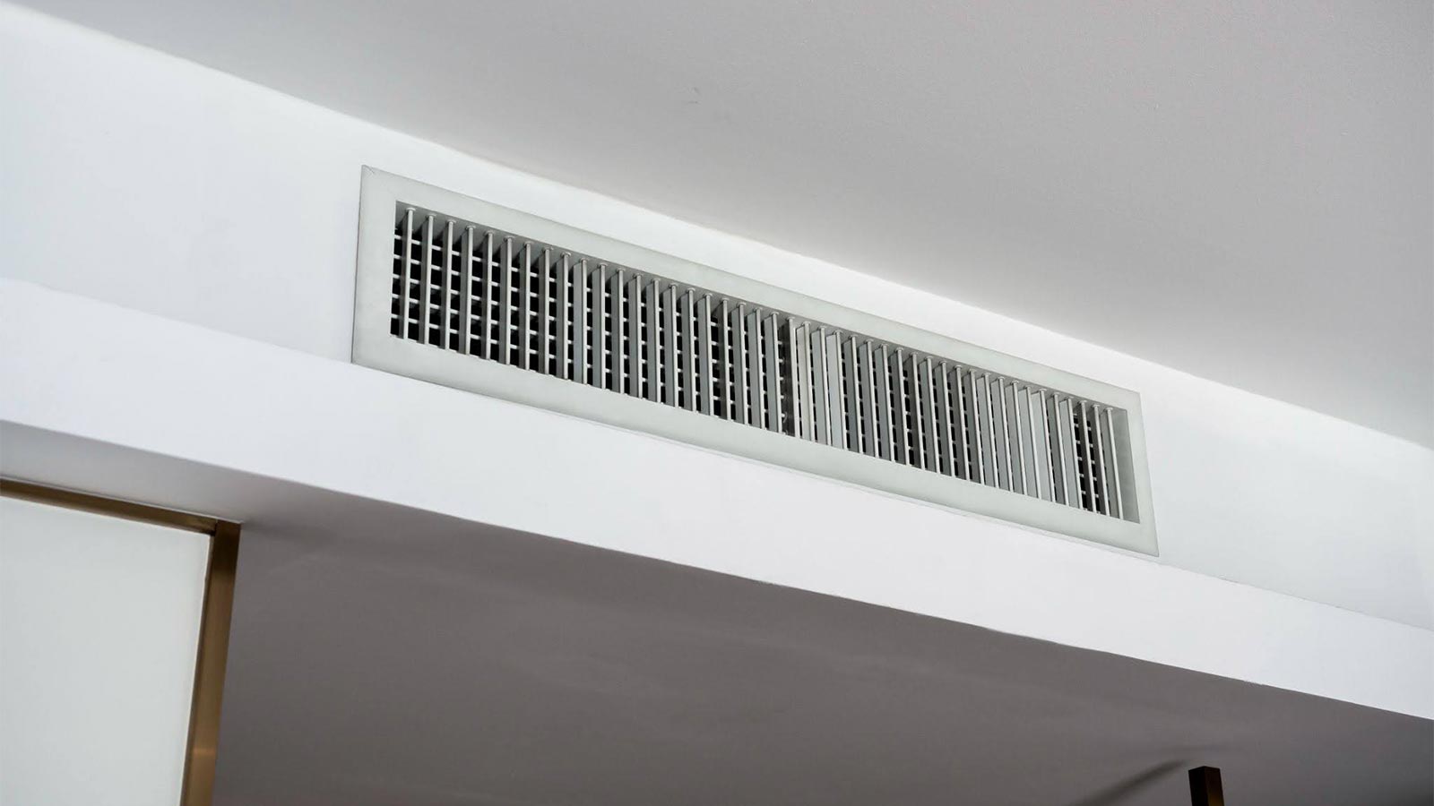 Dusty AC vent grille in a Dubai home showing signs that AC ducts need professional cleaning.