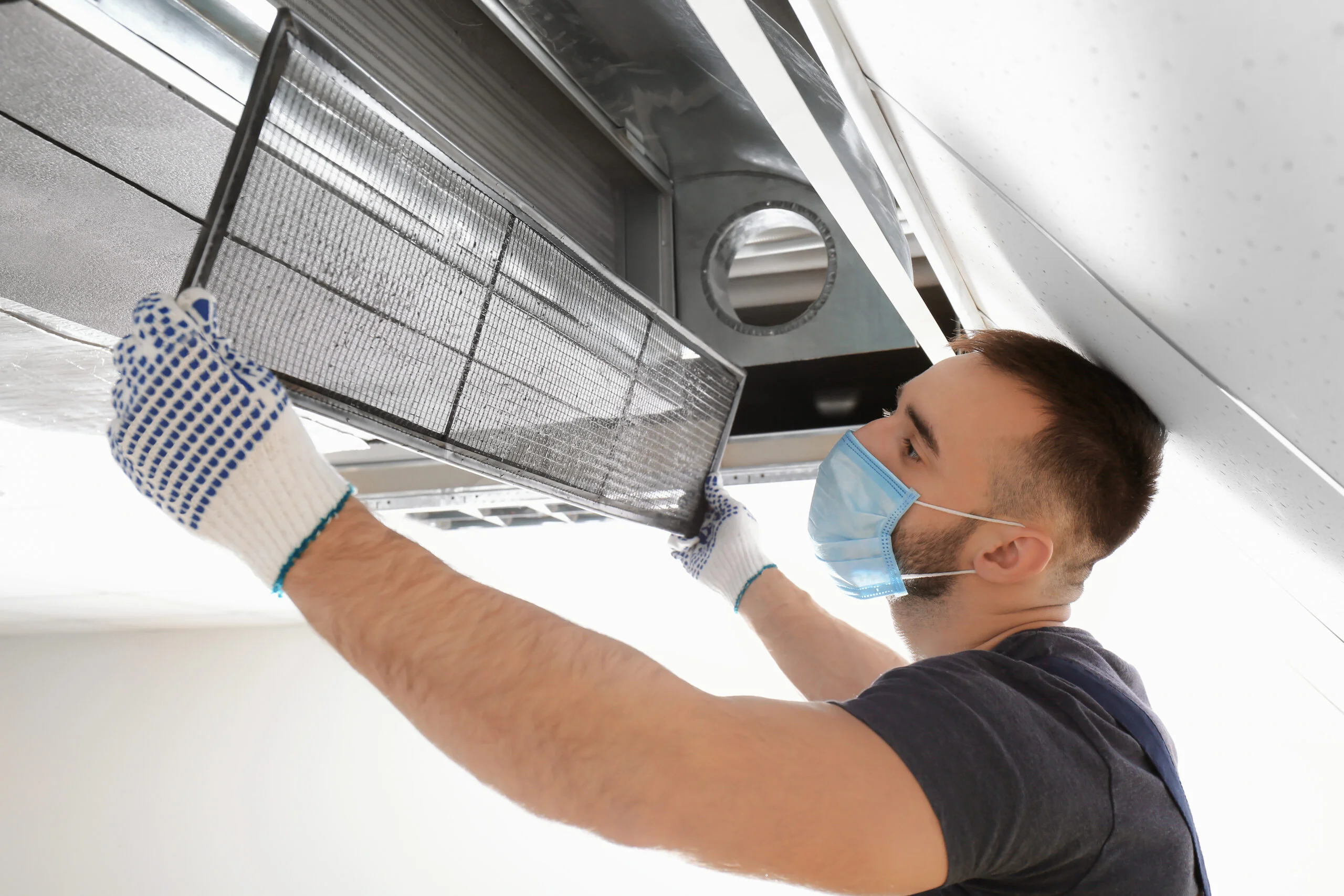Mega Meter technical staff performing specialized AC duct inspection