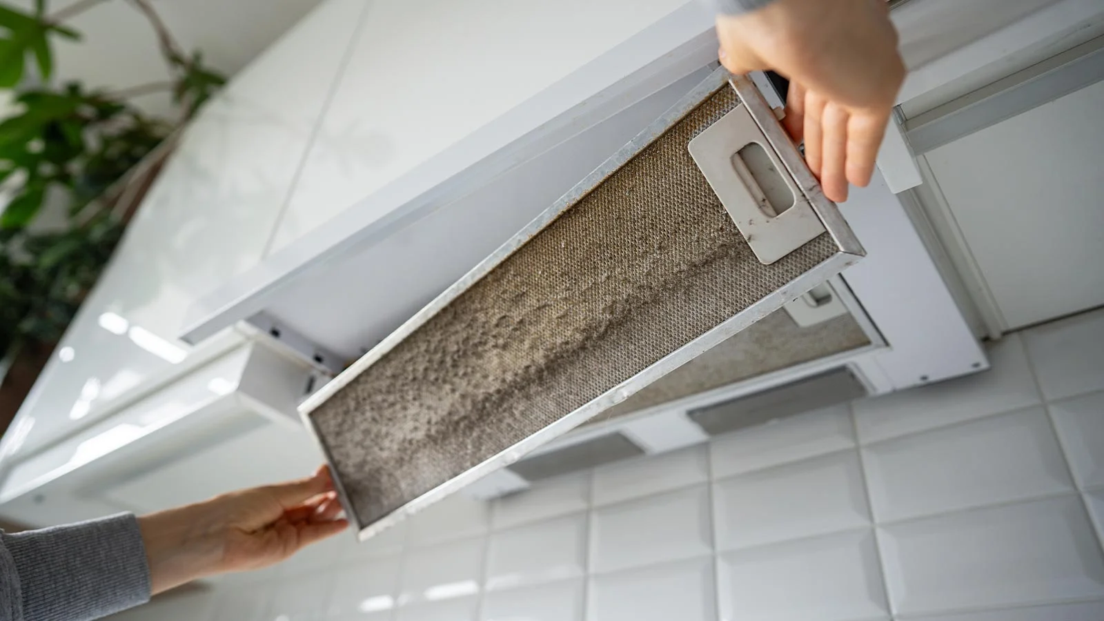 Side by side comparison of an AC technician servicing an outdoor unit and a specialist cleaning an air duct in a UAE home